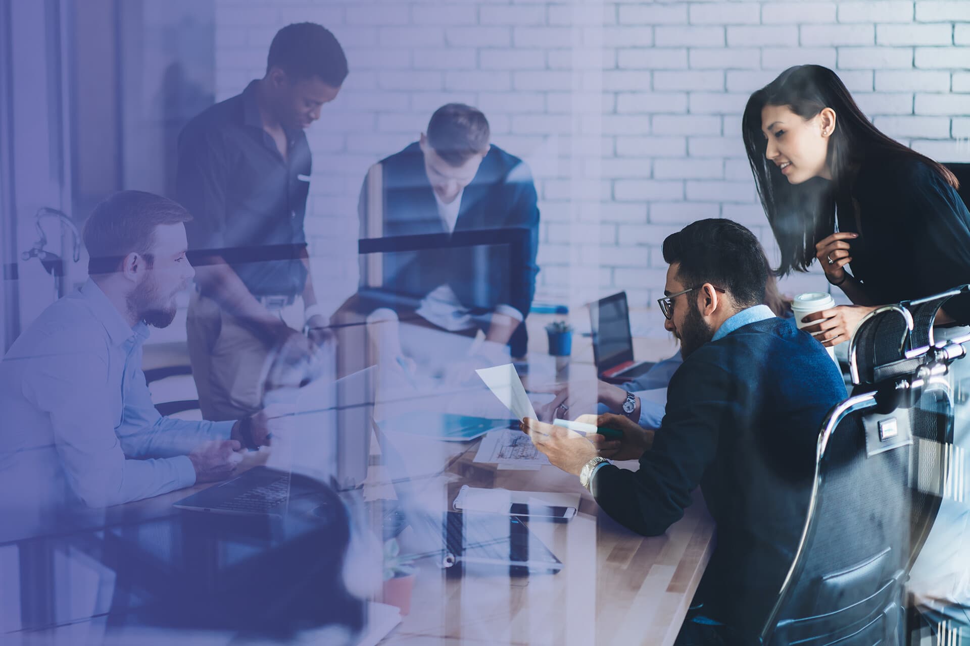 A team working with data across screens